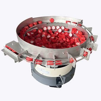 Vibratory bowl feeder configured for plastic caps and closures